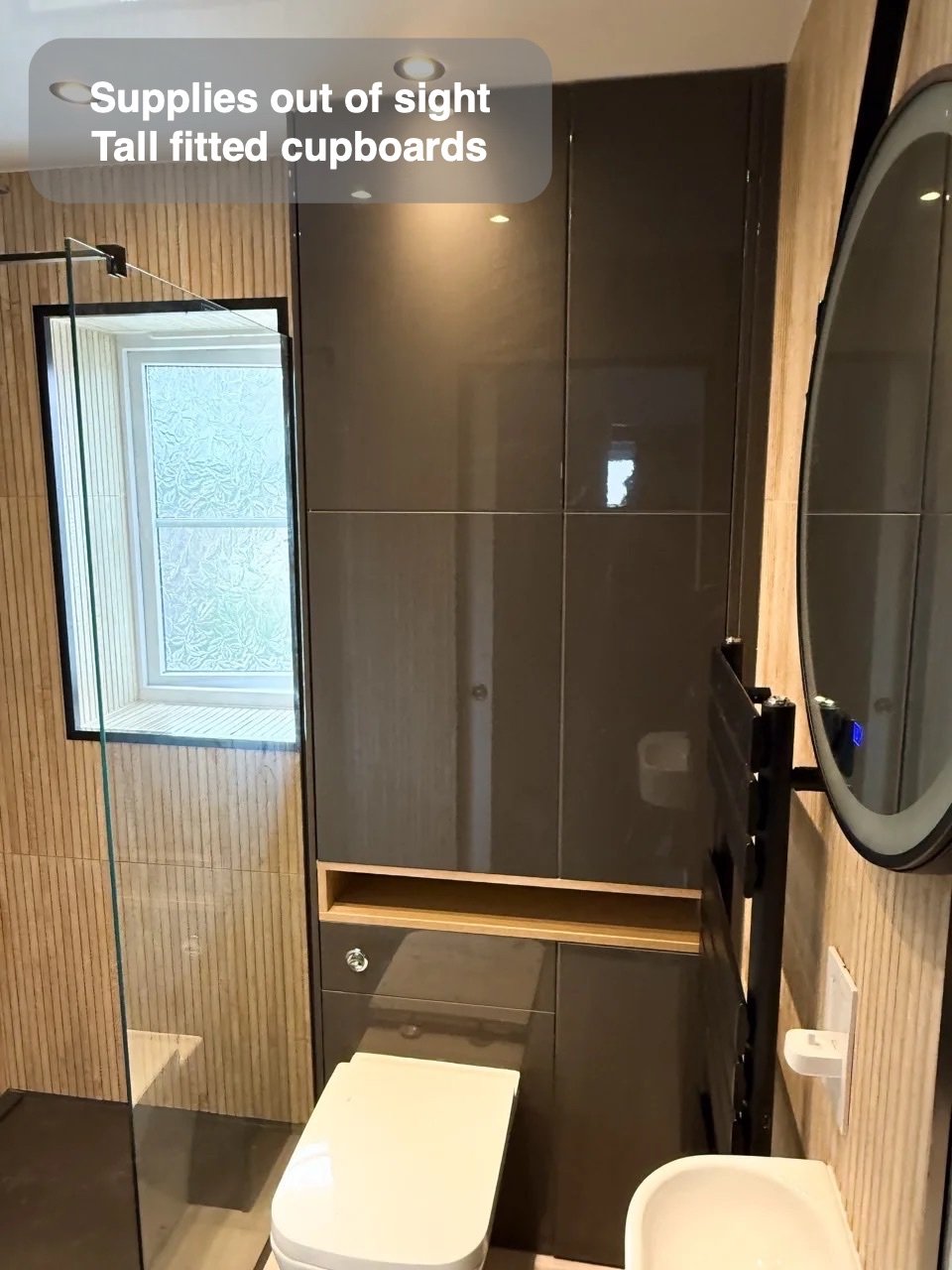 Closed storage using wall height in the completed Ellon bathroom