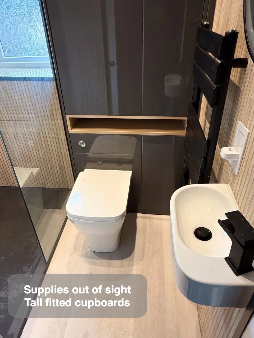 Closed storage using wall height in the completed Ellon bathroom