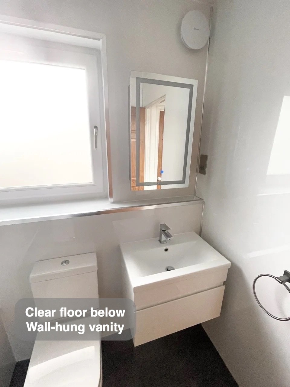 A clearer floor beneath the basin in the completed Westhill bathroom