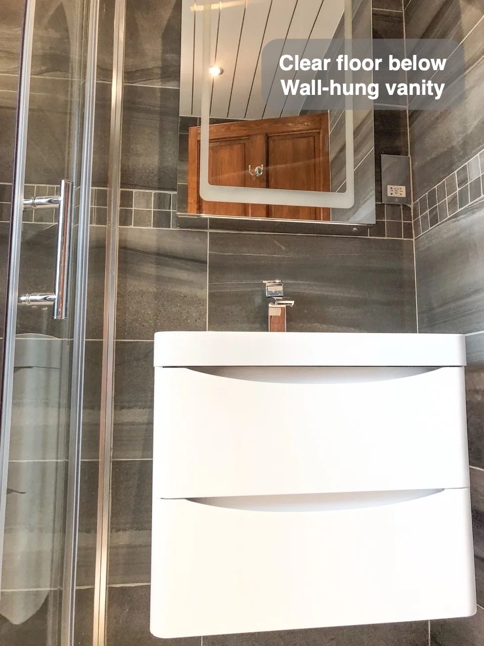 A clearer floor beneath the basin in the completed Northfield, Aberdeen bathroom