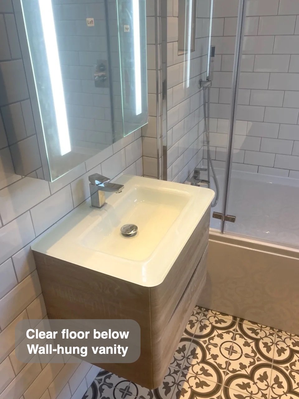 A clearer floor beneath the basin in the completed Bridge of Don bathroom