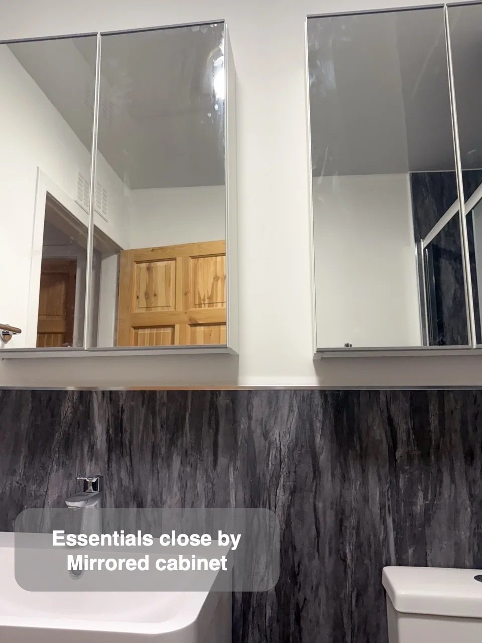 Small items near the mirror in Aberdeen bathroom