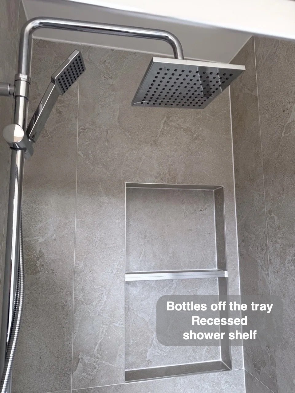 Shower outlets above recessed shelf