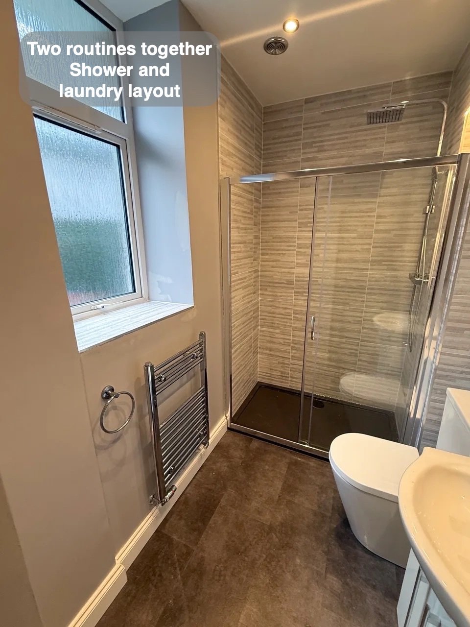 Completed shower room with basin and radiator