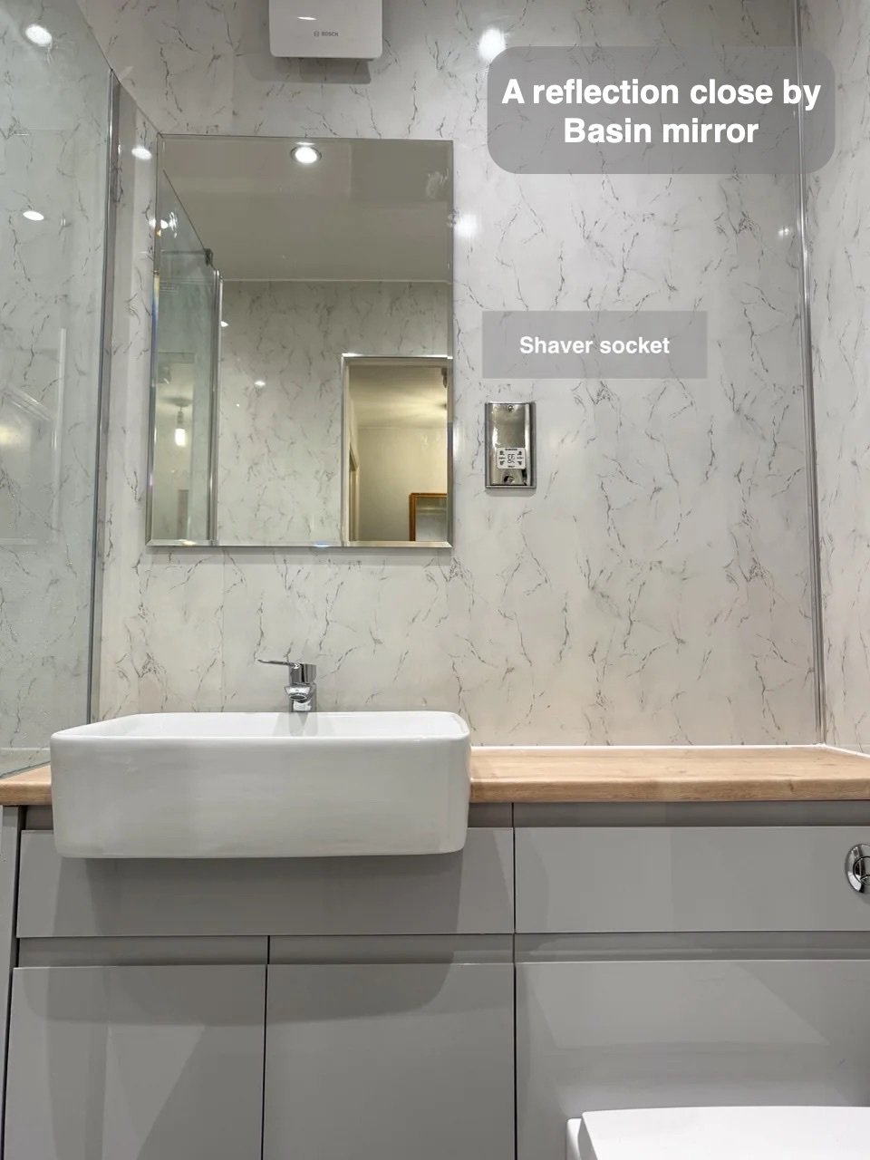 Small items near the mirror in Bucksburn bathroom