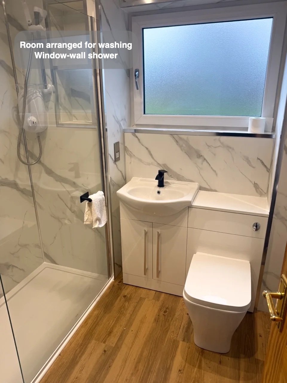 Compact shower beside basin and toilet