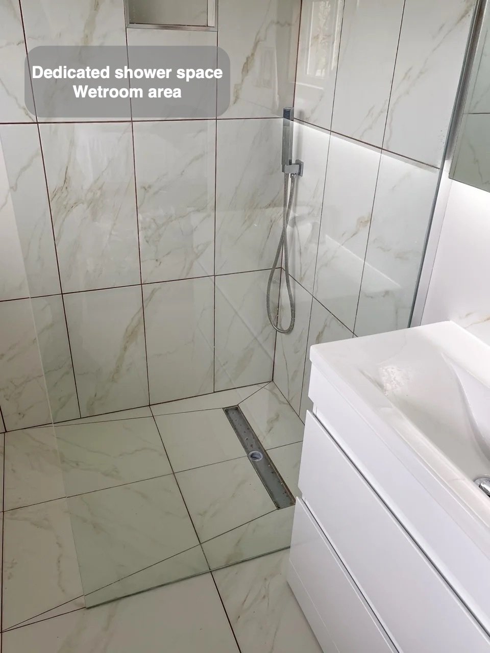 A defined wetroom area in the completed West End, Aberdeen bathroom